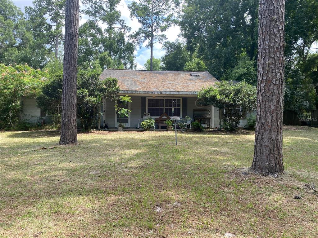 a view of a house with swimming pool