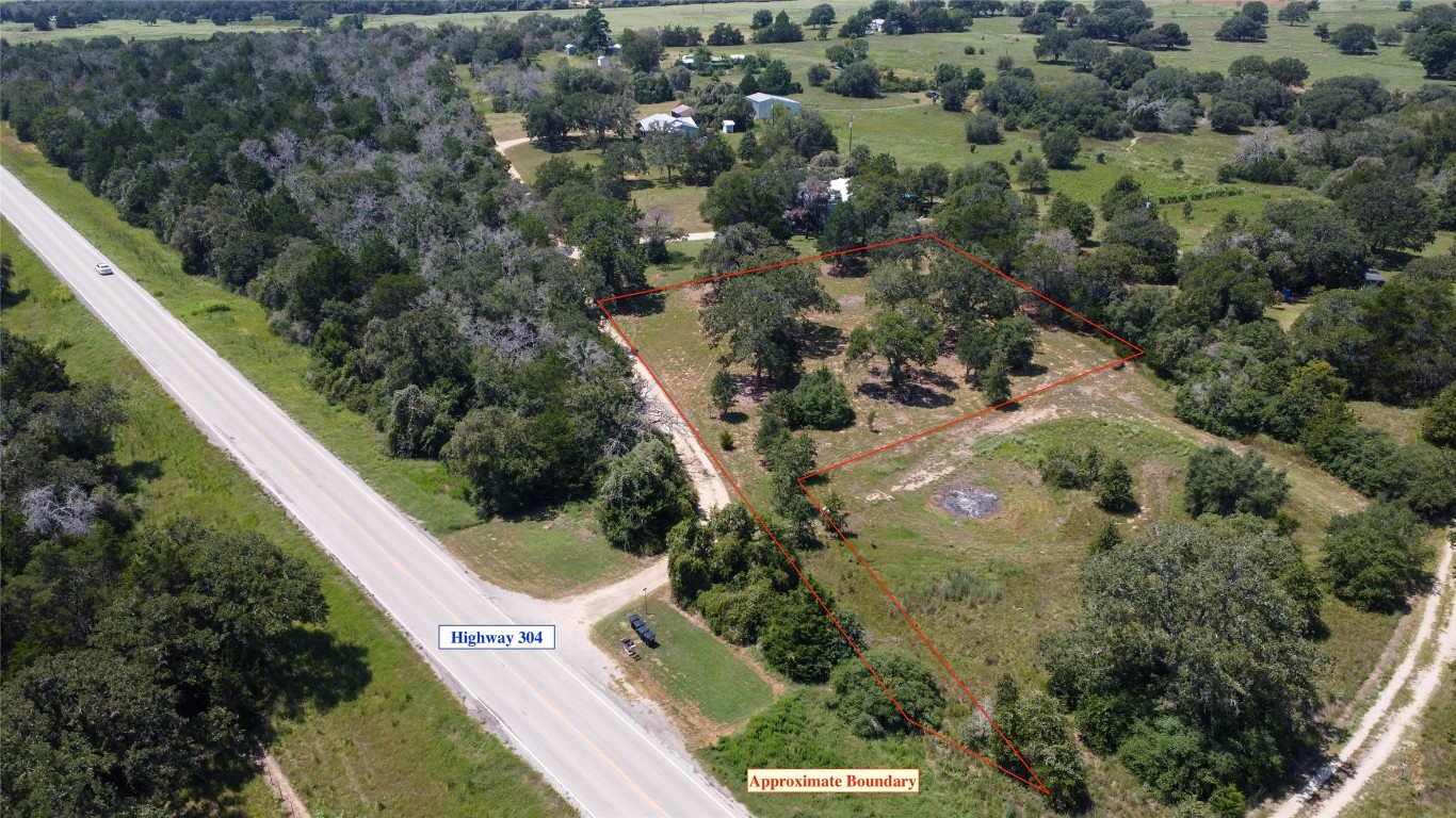 an aerial view of residential house with outdoor space