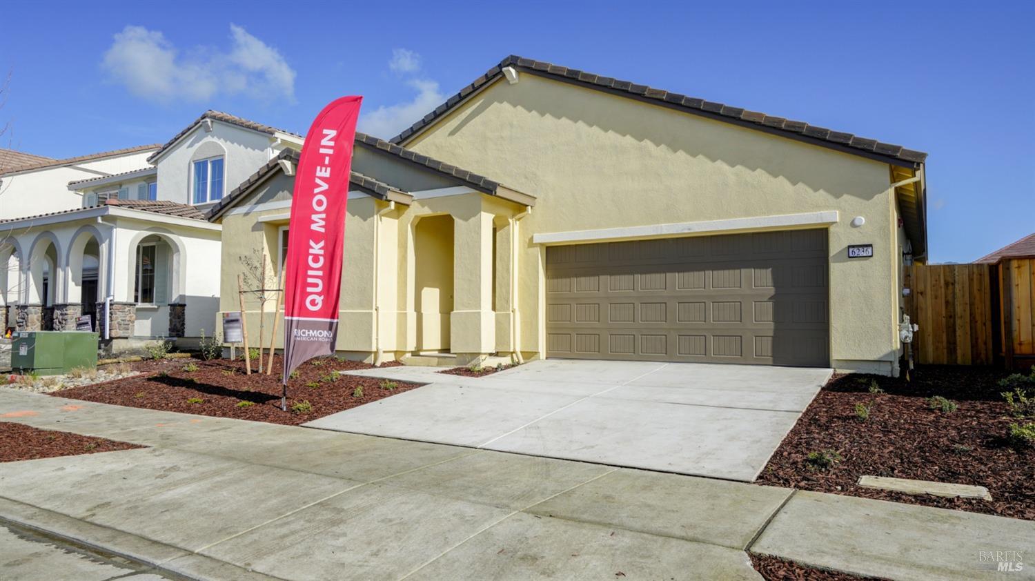 a front view of a house with garage