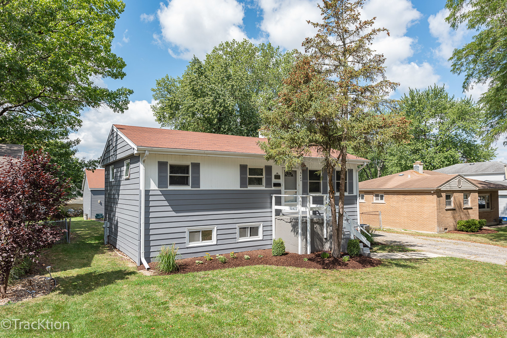 a view of house with yard and entertaining space