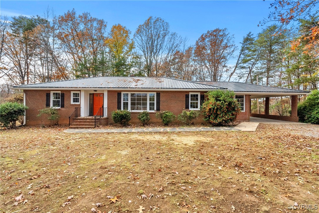 Single story home with a carport