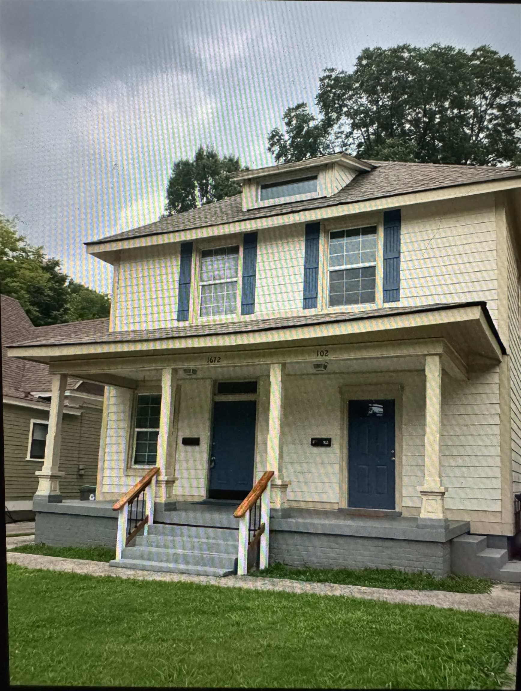 front view of house with a yard