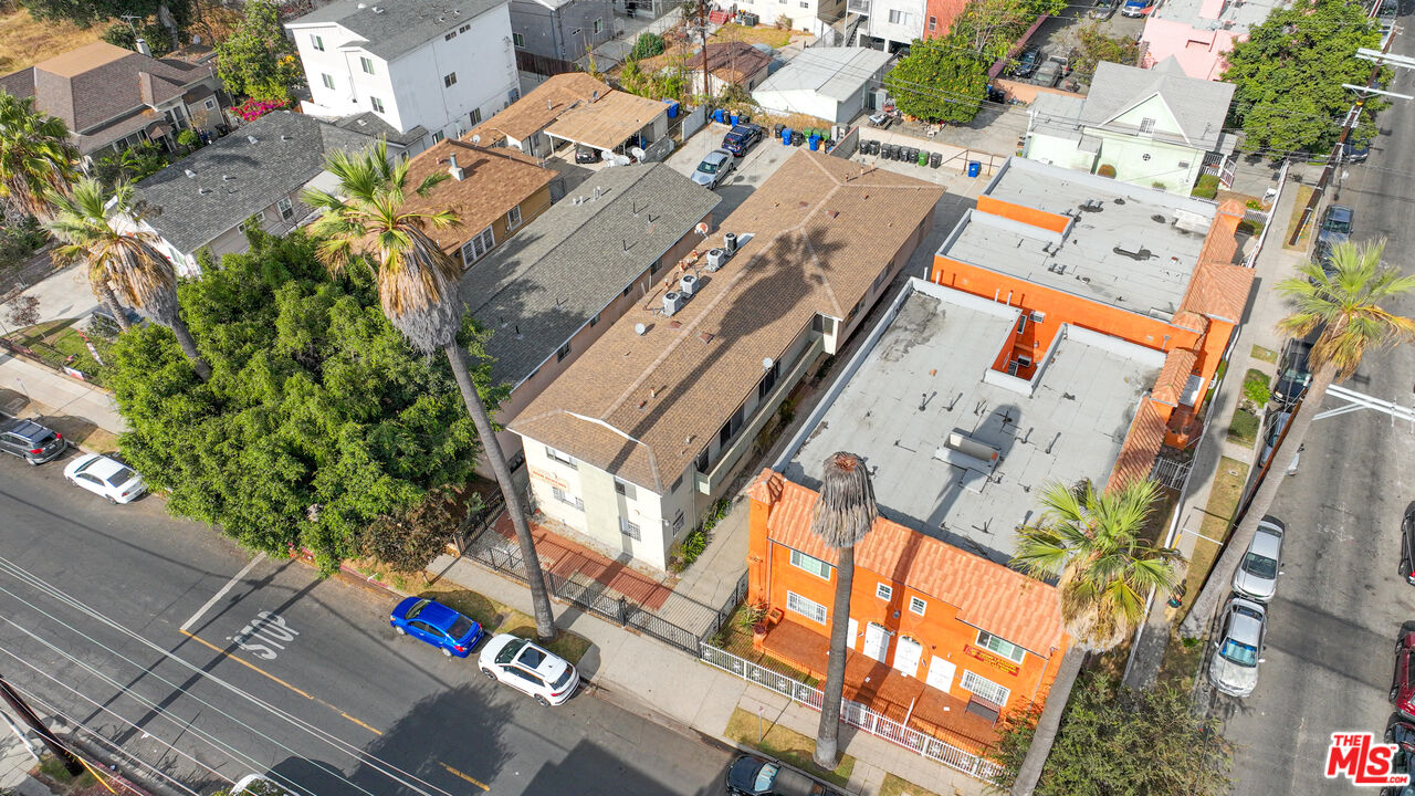 an aerial view of residential house with outdoor space and parking