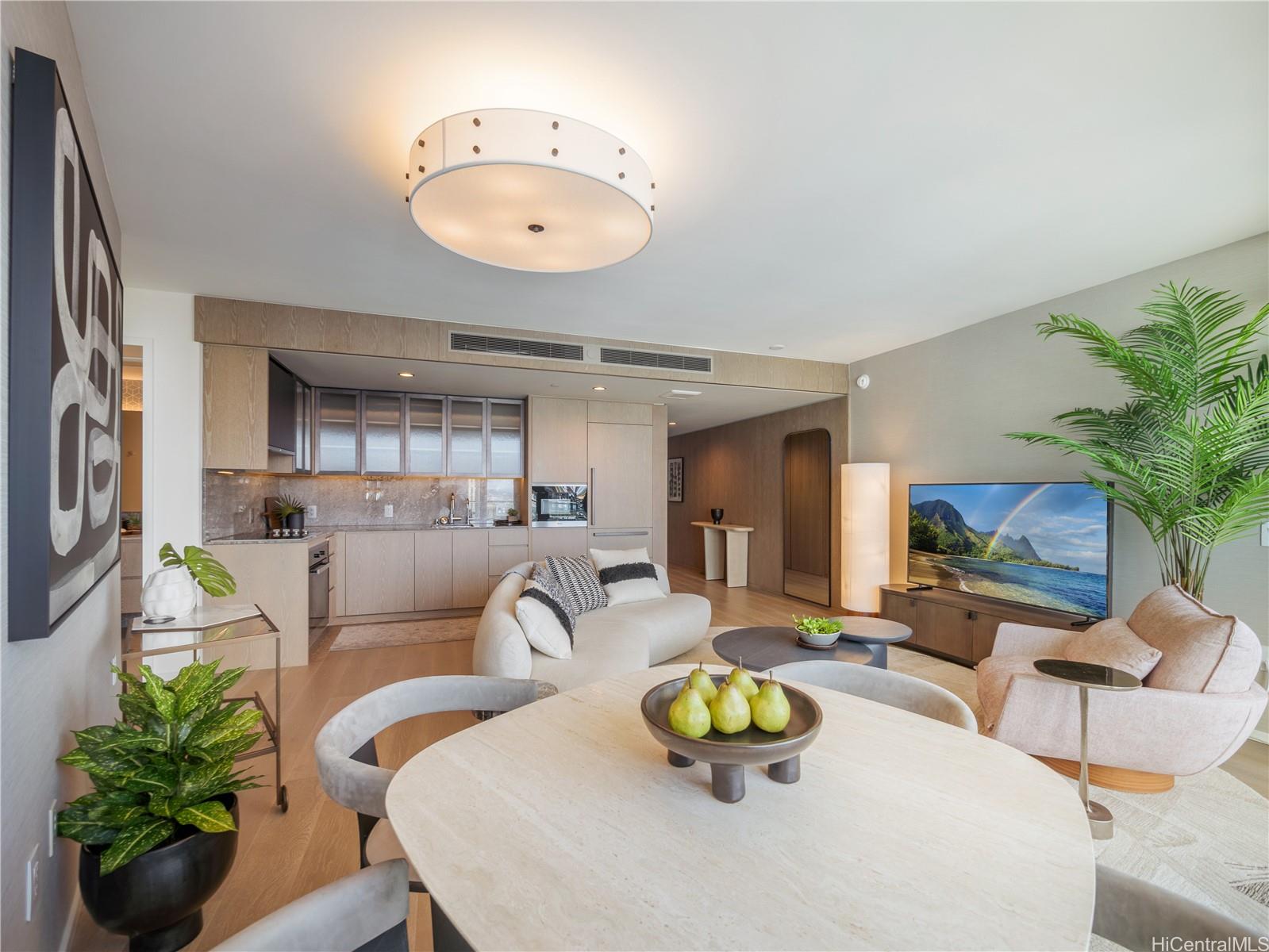 a living room with furniture kitchen view and a large window