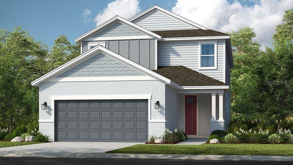 a view of house with garage and yard