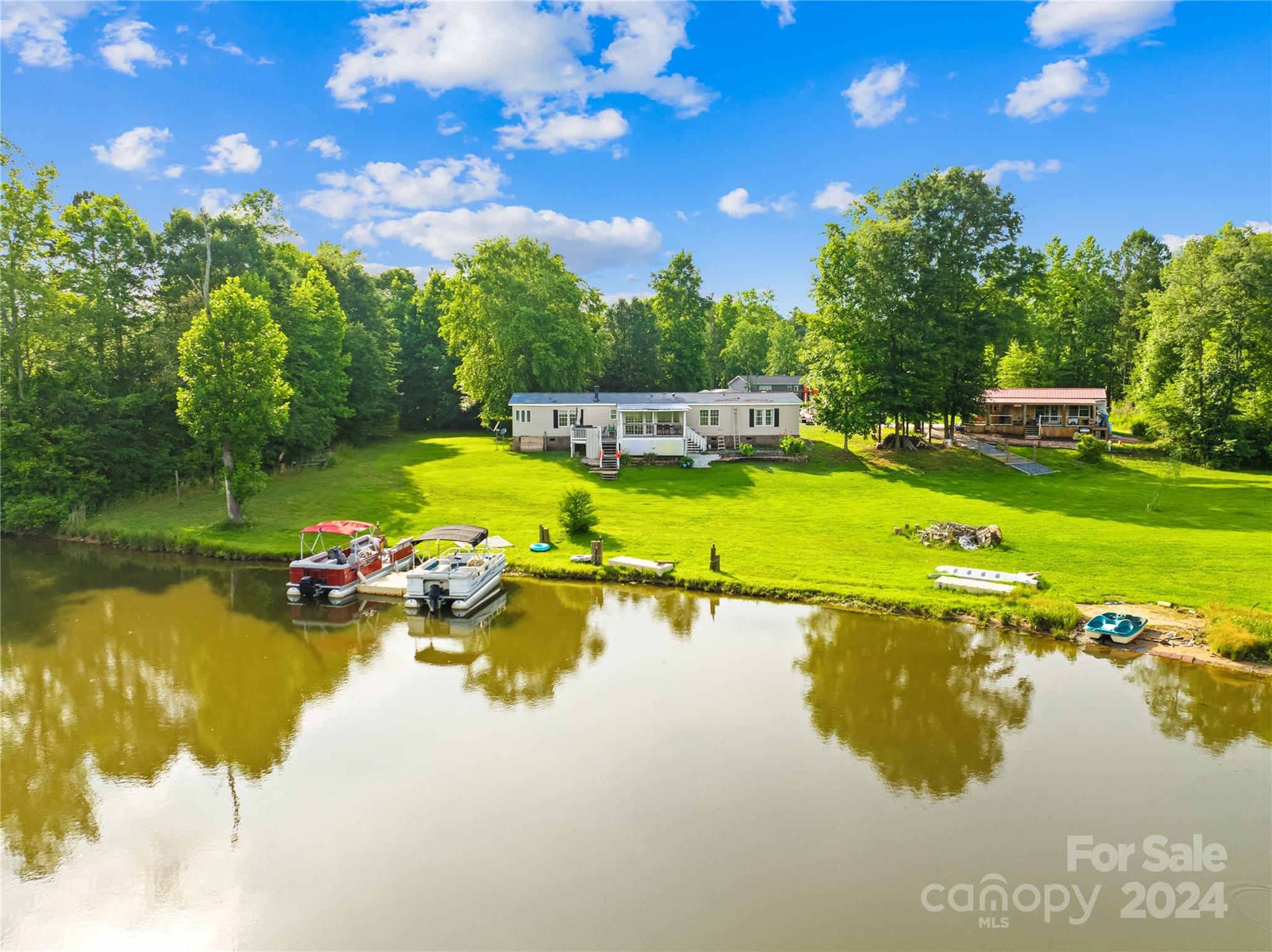 a view of a lake with houses in the back