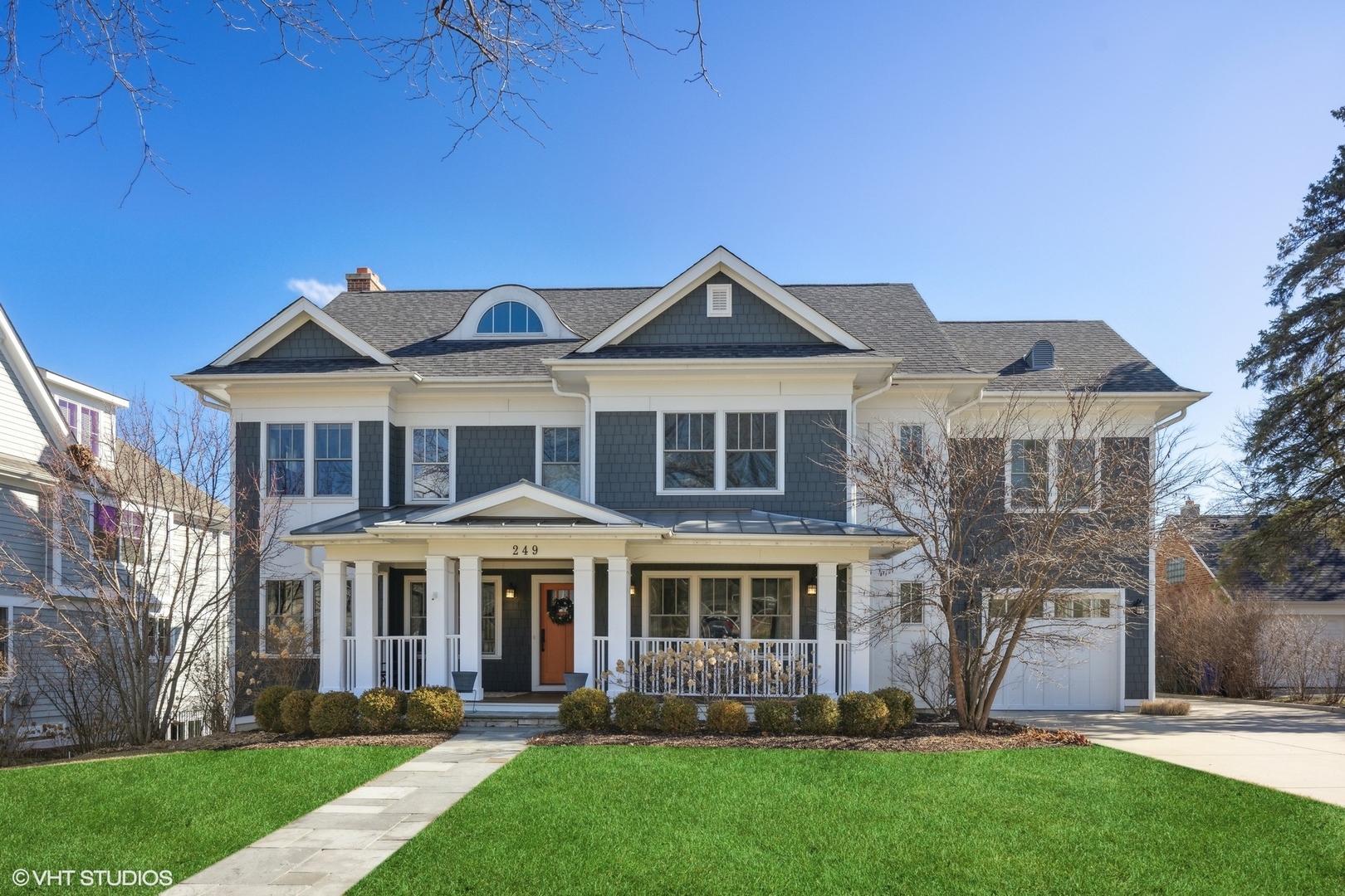 a front view of a house with a yard