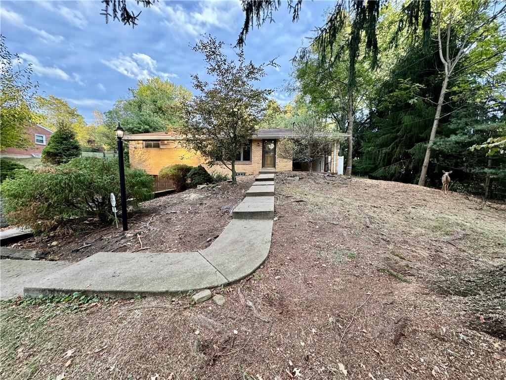 front view of a house with a yard