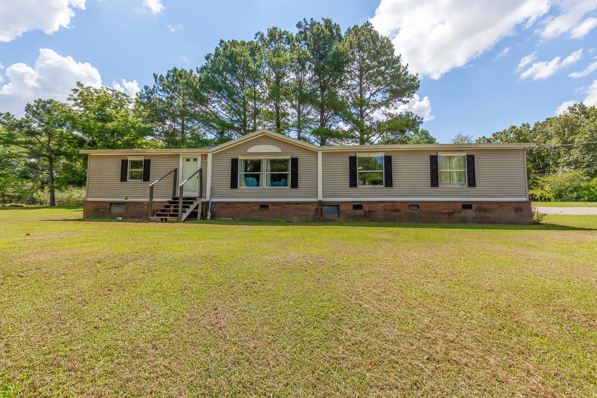 a front view of house with yard having outdoor seating