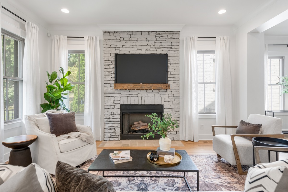 a living room with furniture and a fireplace