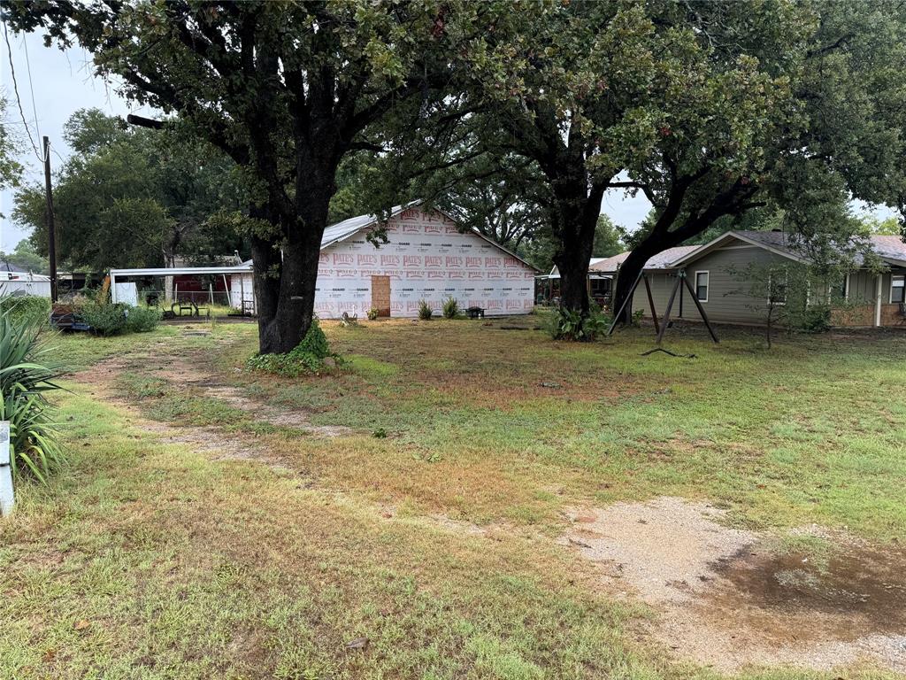 a house with a tree in front of a house