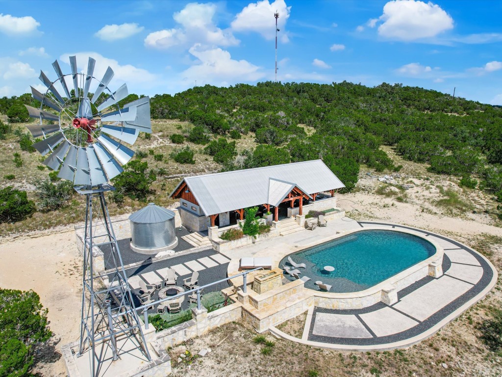 a view of a swimming pool with a yard