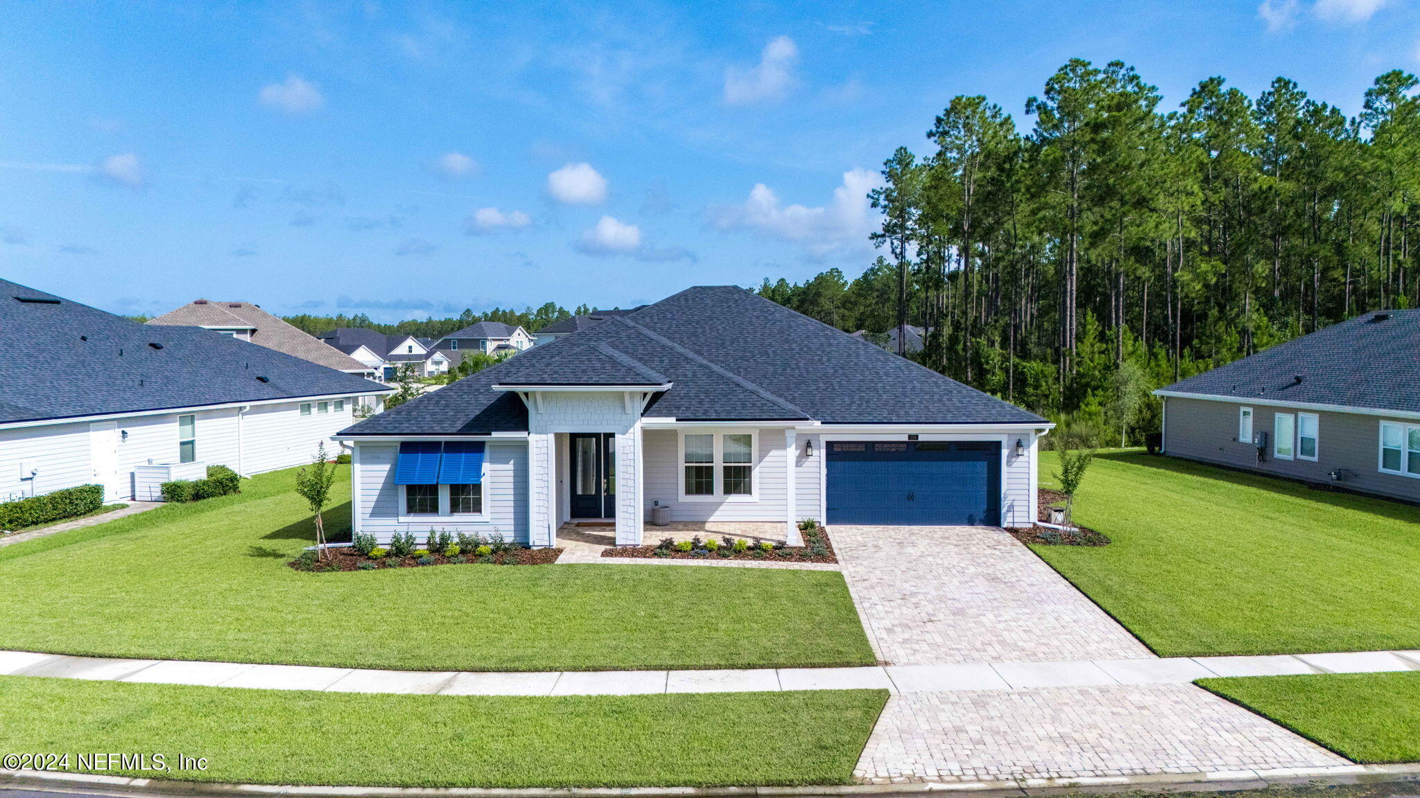 front view of a house with a yard