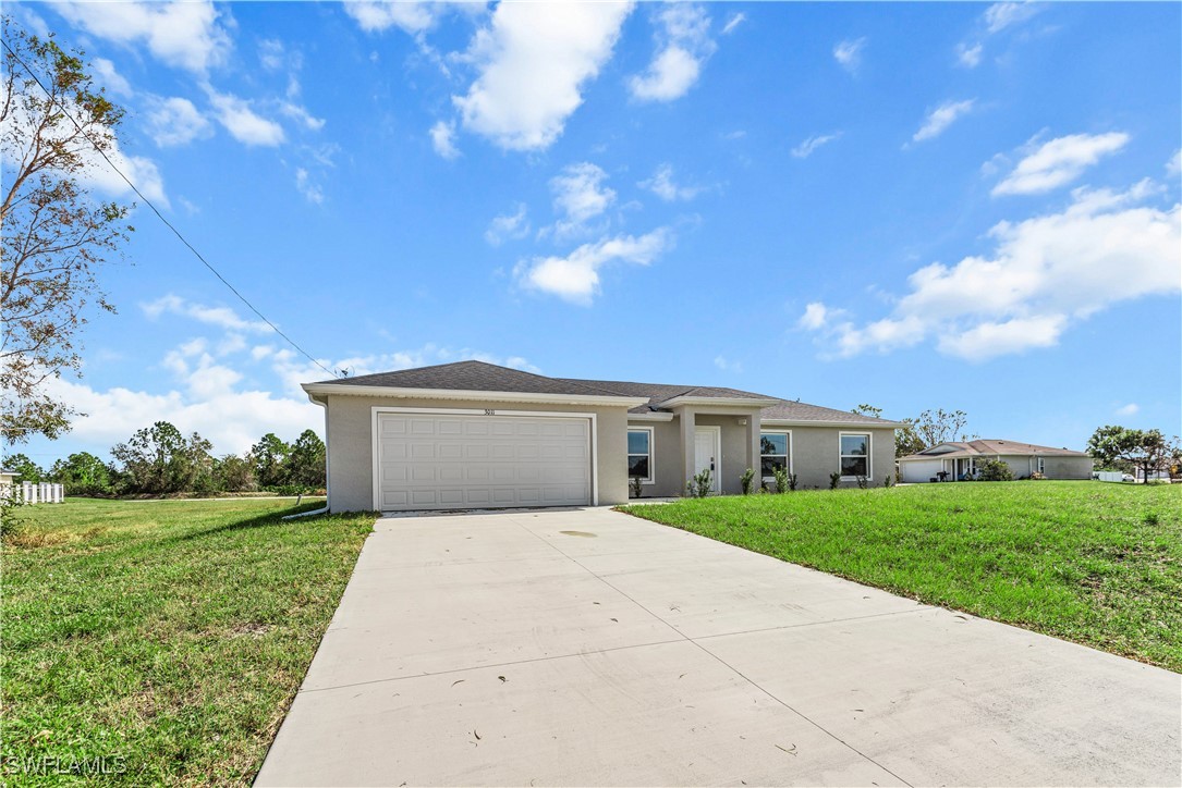 a front view of a house with yard