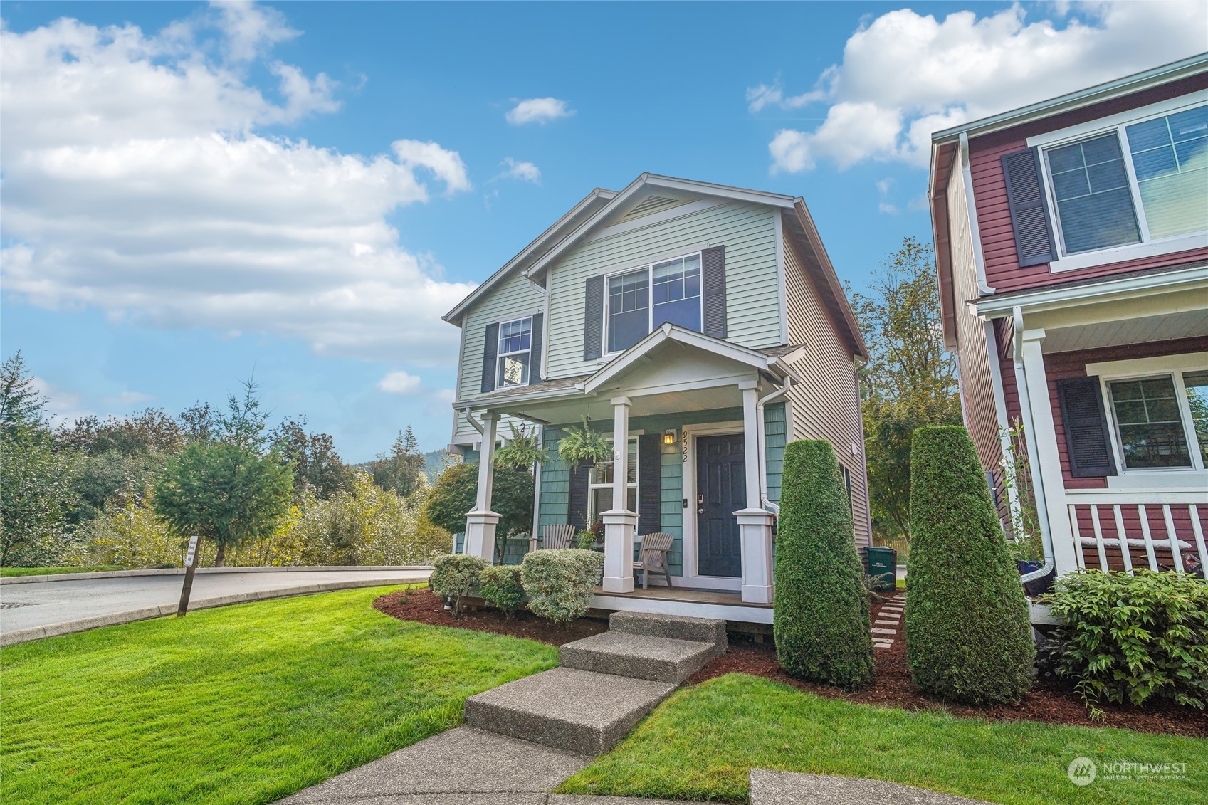 a front view of a house with a yard