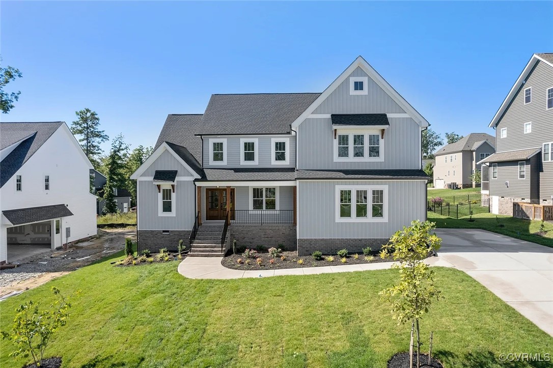 a front view of house with yard and outdoor seating