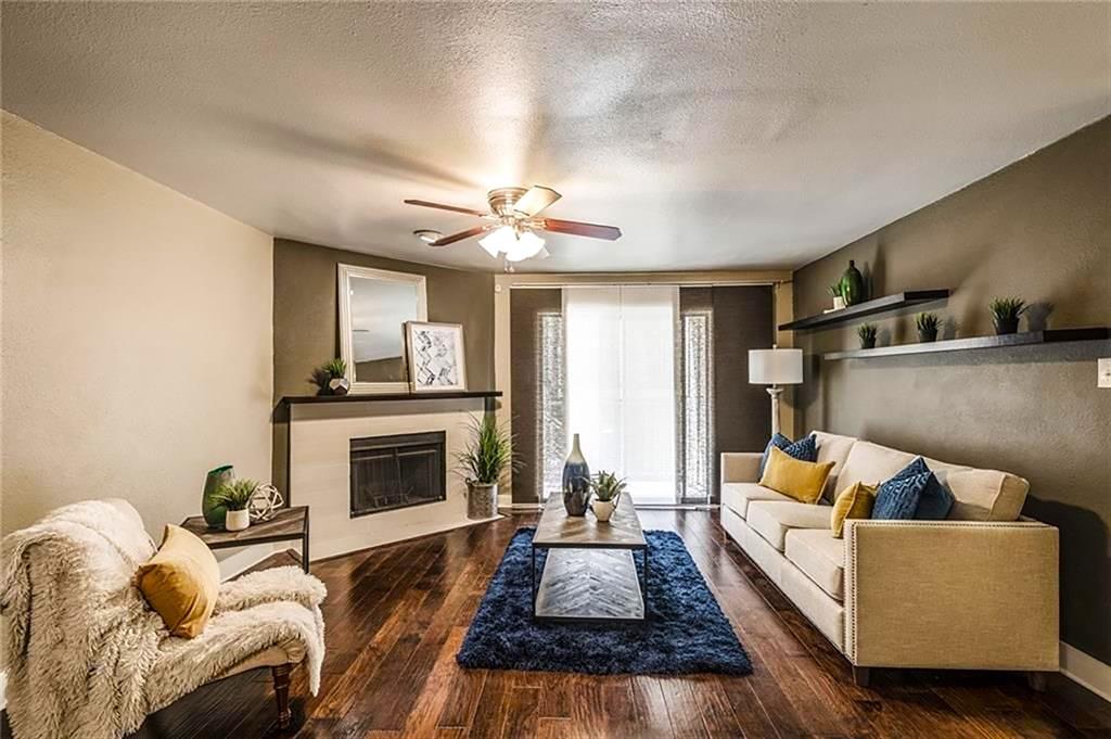 a living room with furniture fireplace and flat screen tv