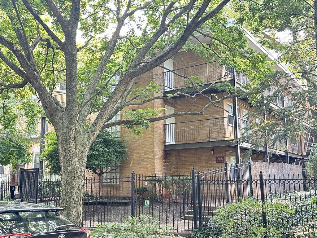 a view of a house with a tree