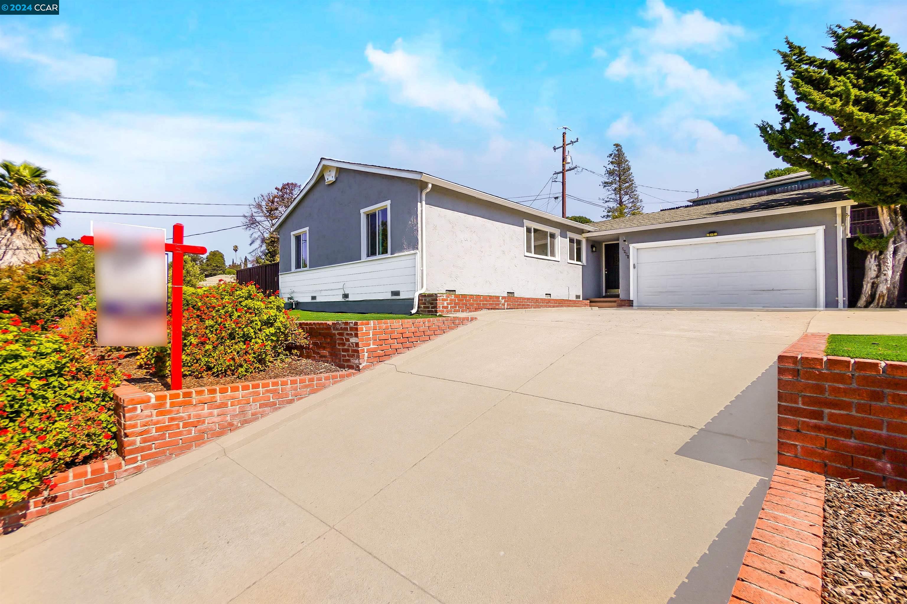 a front view of a house with yard