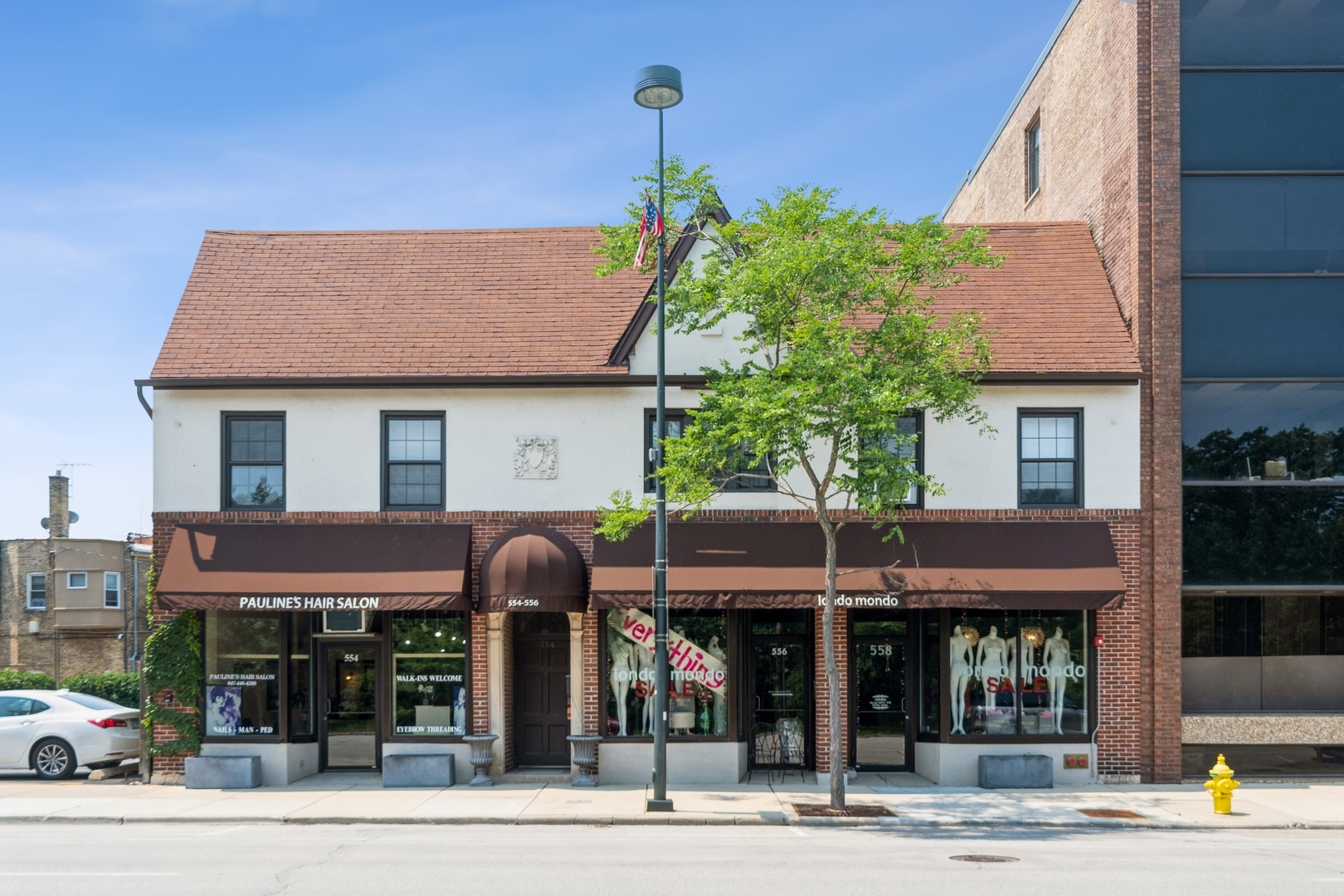 a front view of a building with street view