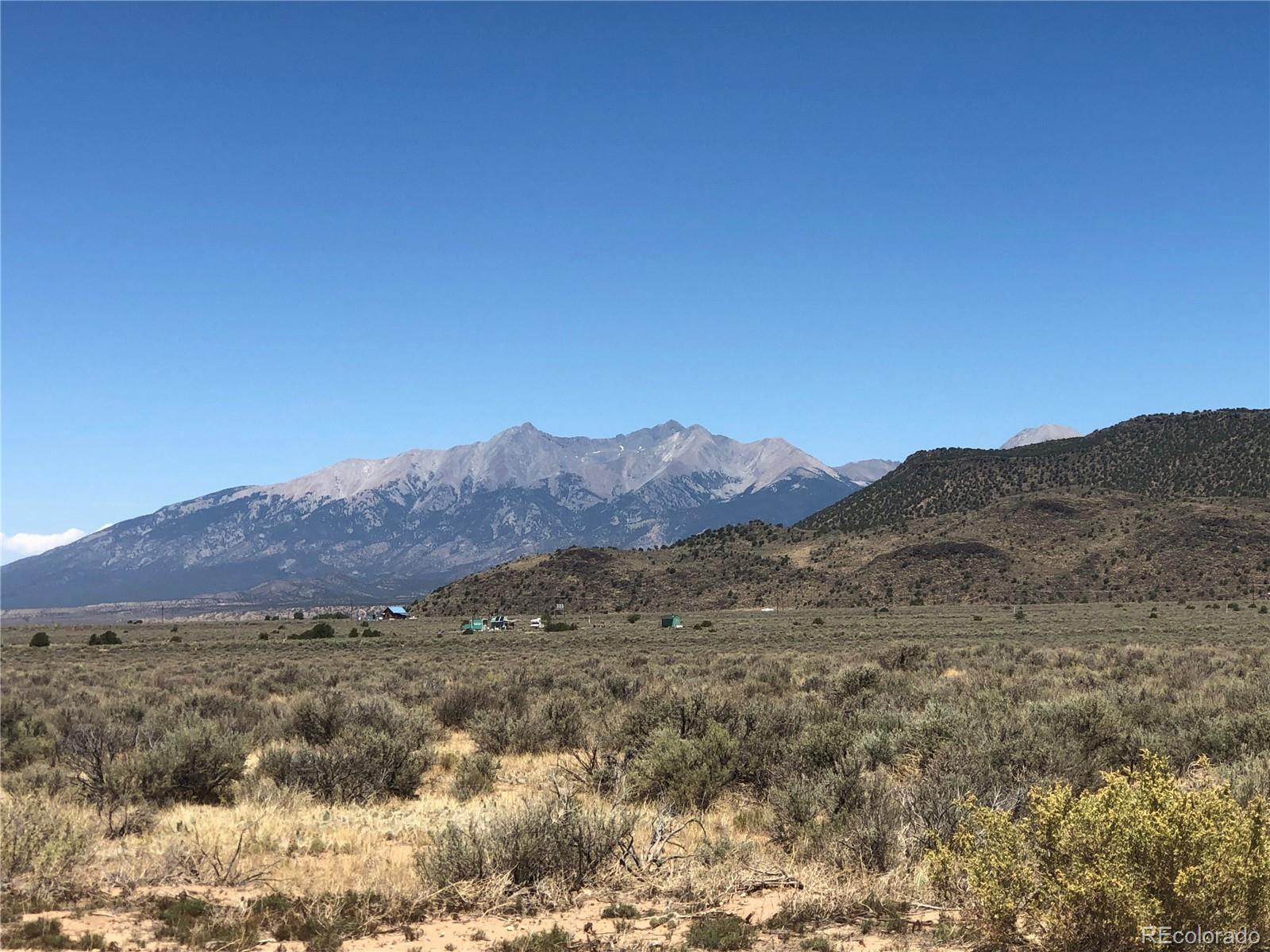 a view of mountains and valleys