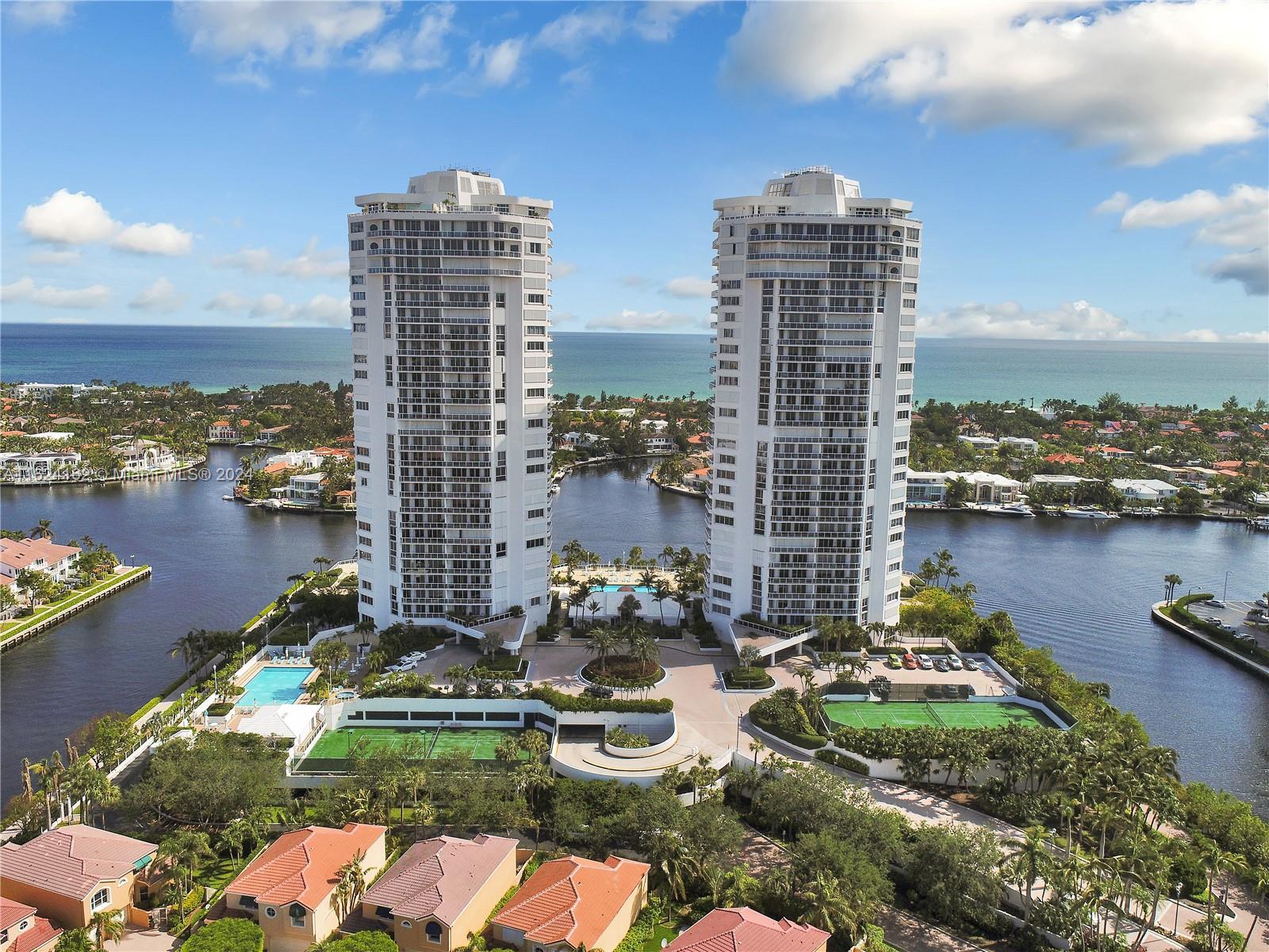 a view of a lake with tall buildings