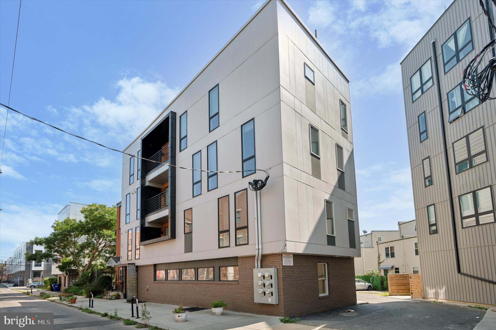 a front view of a building with lot of windows