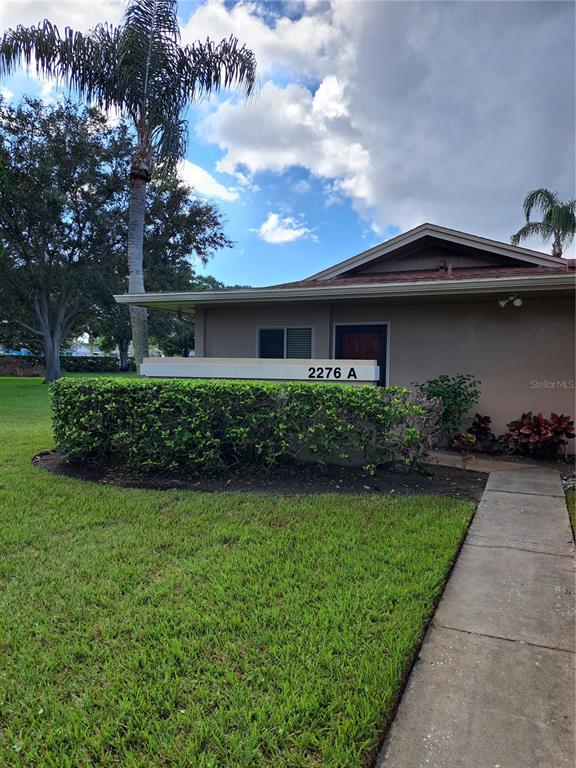 a house with garden in front of it