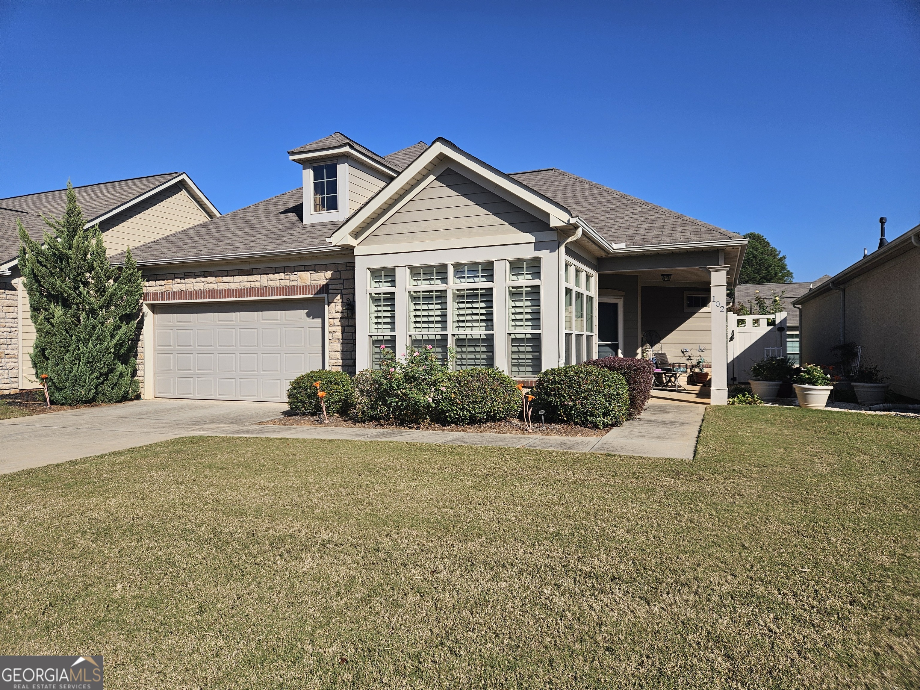 a front view of a house with a yard