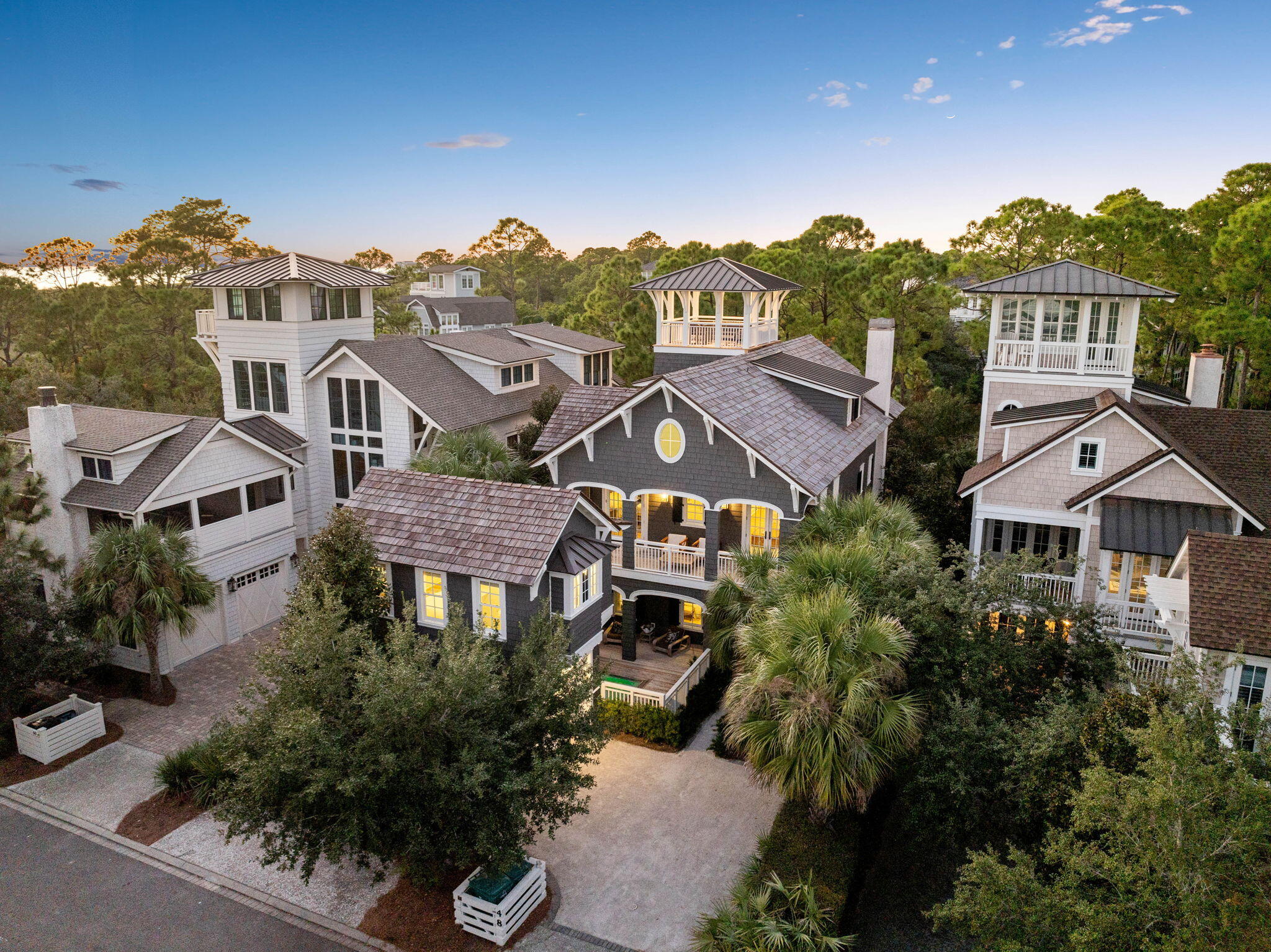 an aerial view of houses with a street