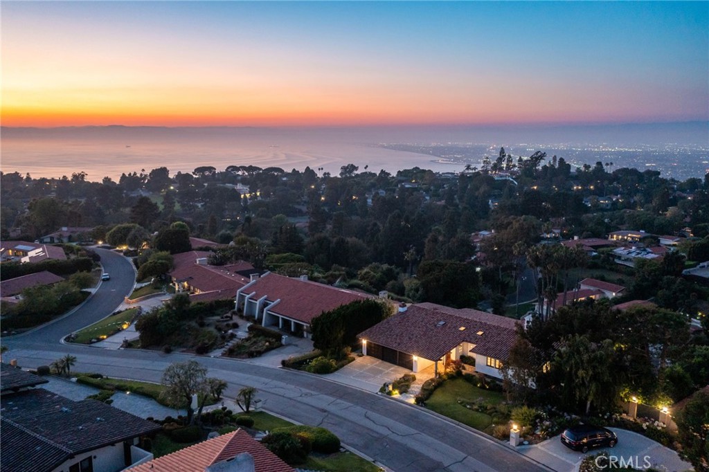 an aerial view of house with ocean view