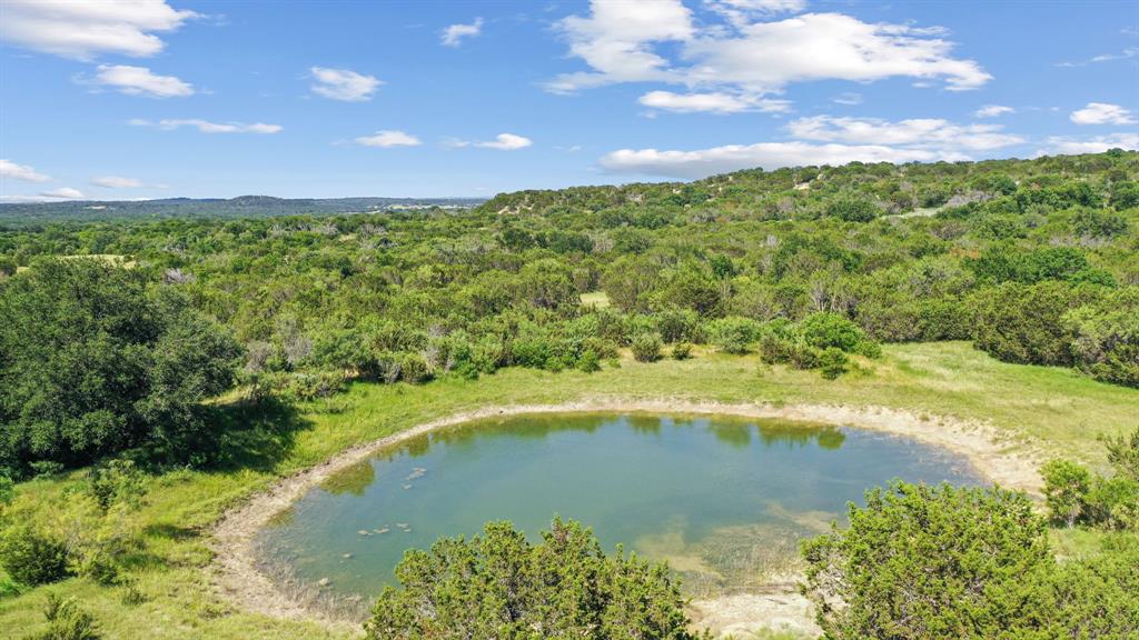 a view of a lake with a yard