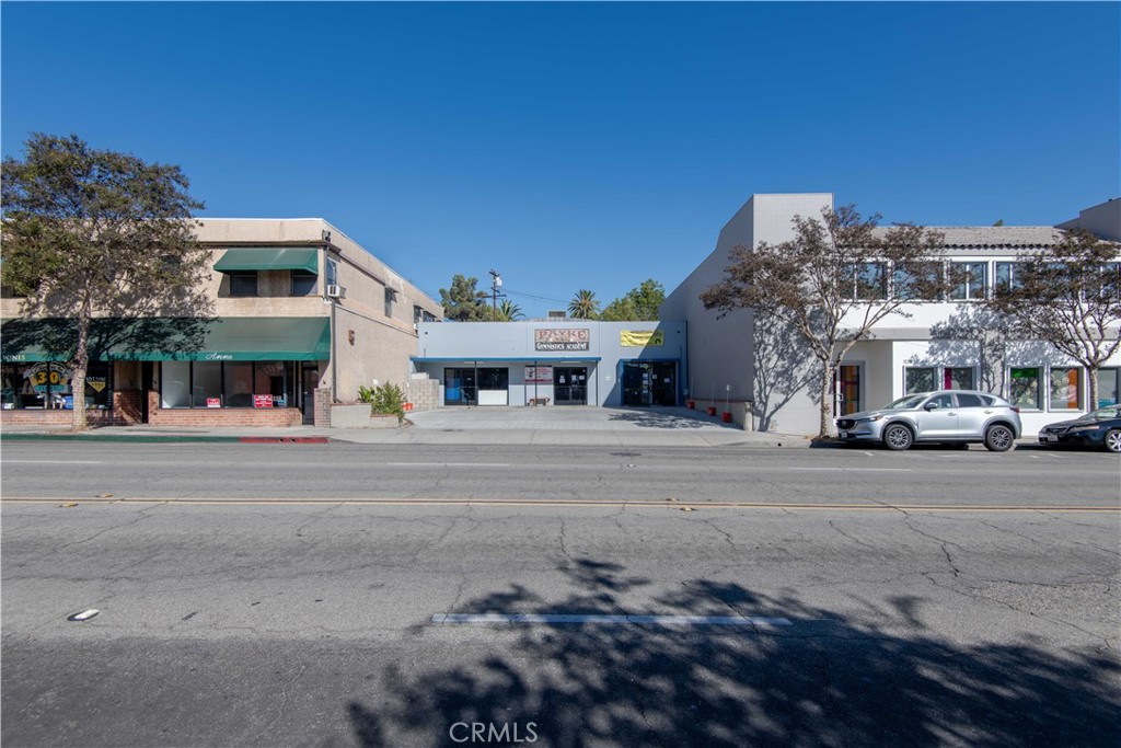 a view of a building with a street