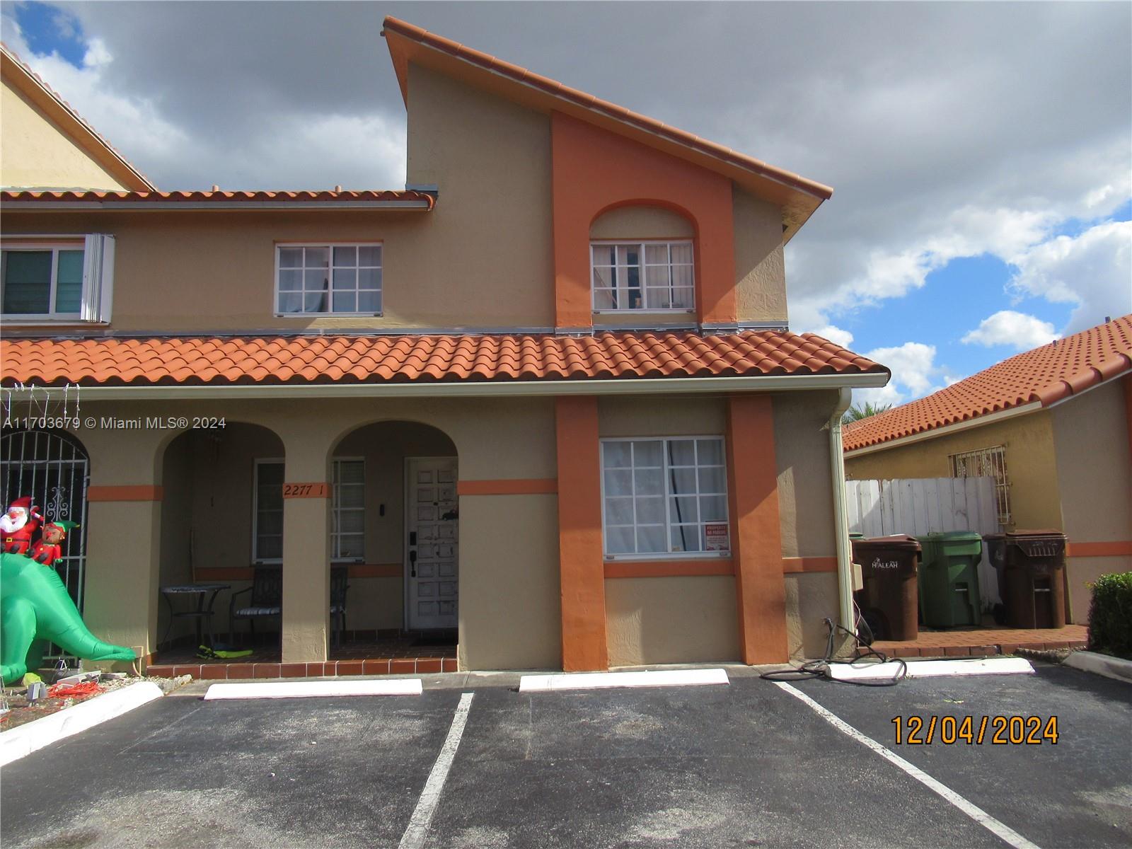 a front view of a house with yard