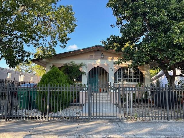 a front view of a house with fence