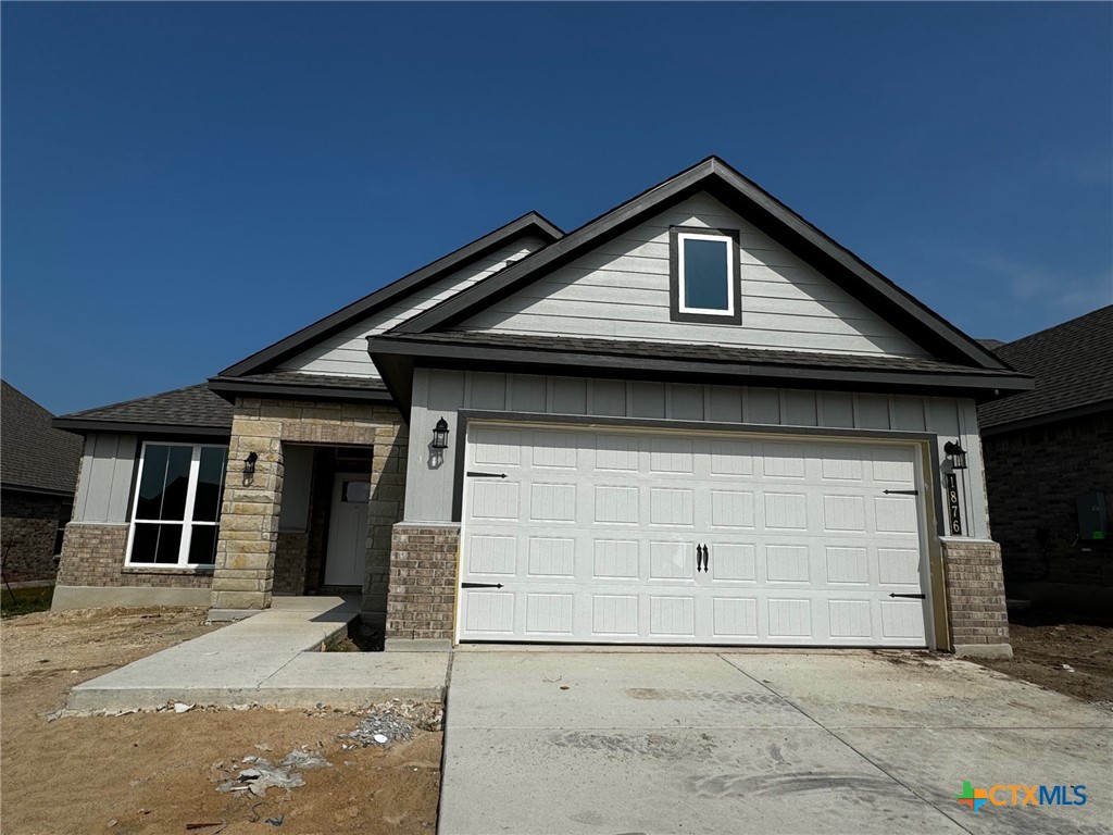 a front view of a house with garage