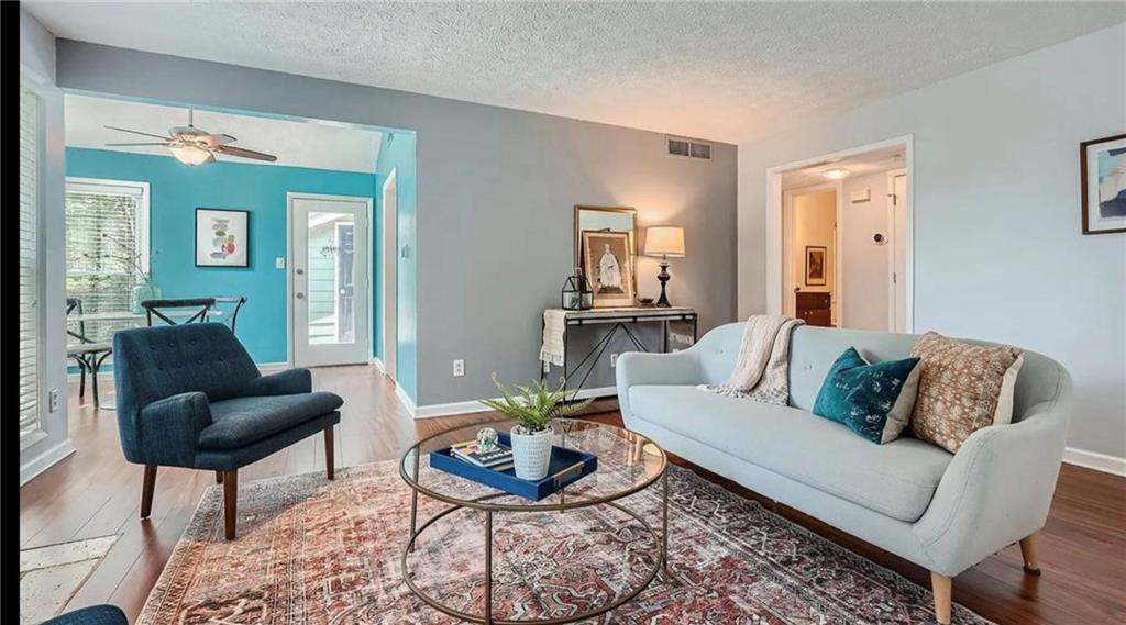 a living room with furniture and a rug