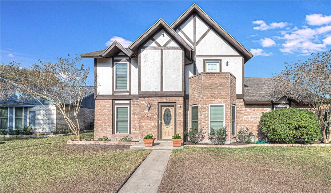 front view of a house with a yard