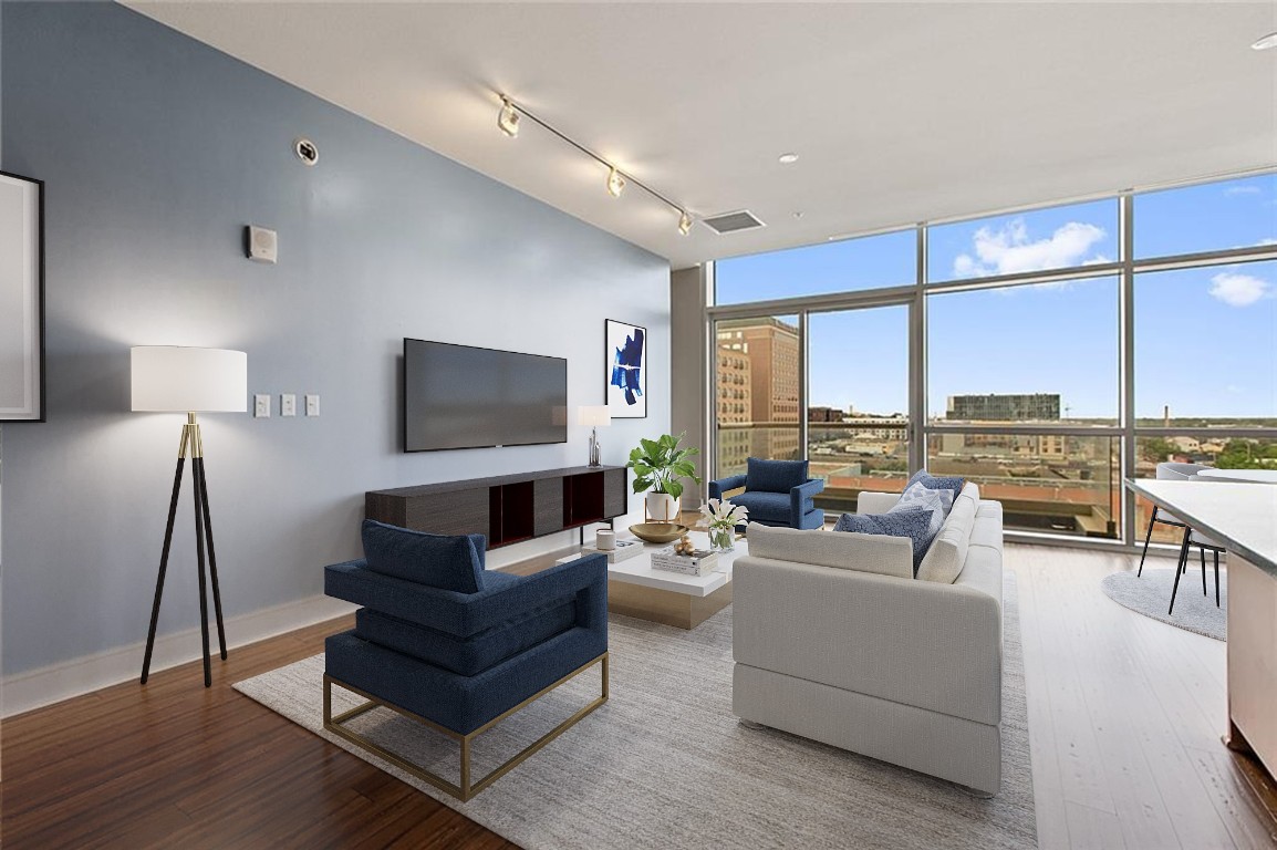 a living room with furniture and a flat screen tv