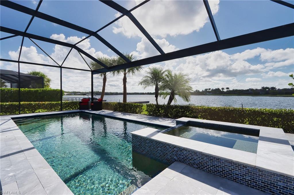 a view of swimming pool with outdoor seating and city view