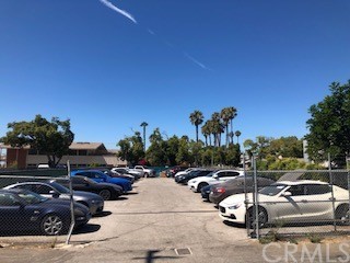 a view of cars parked on the roadside