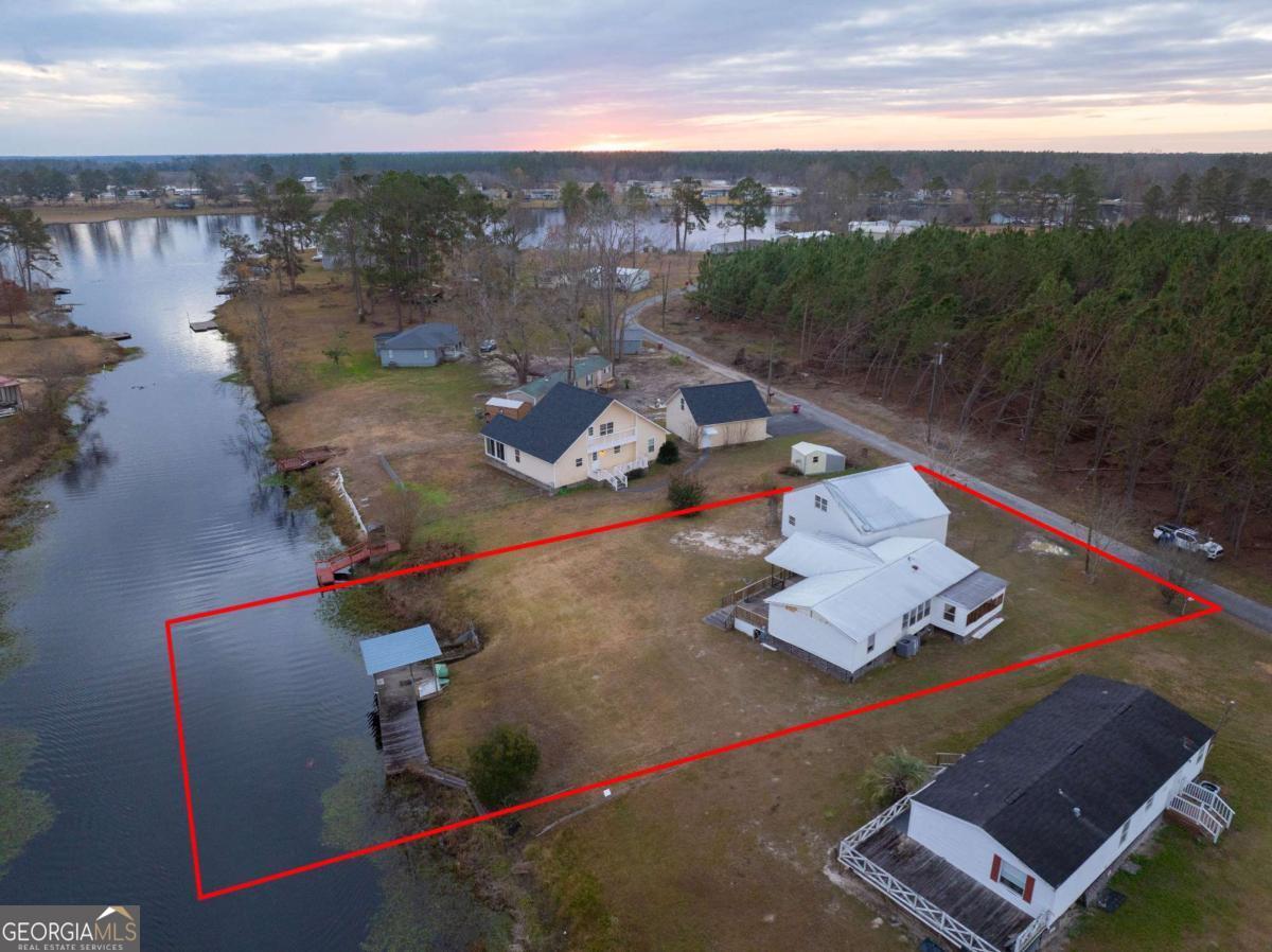 an aerial view of a house with outdoor space