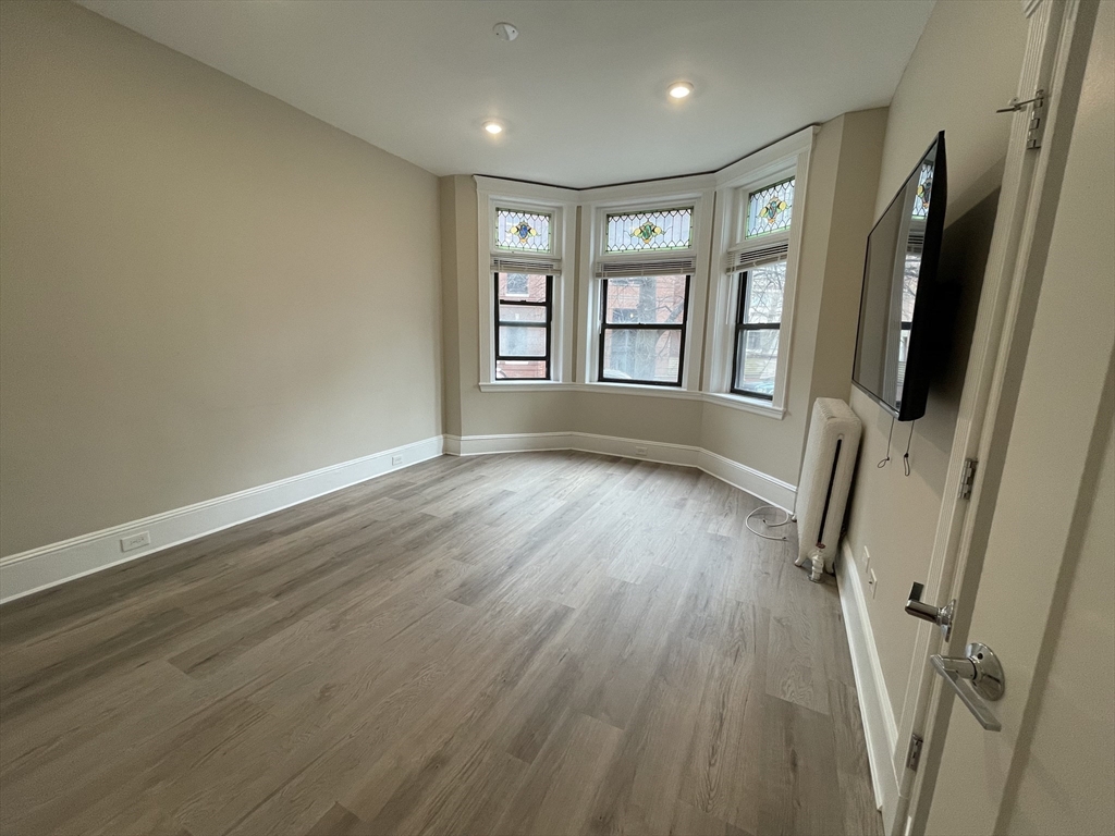 wooden floor and window in a room