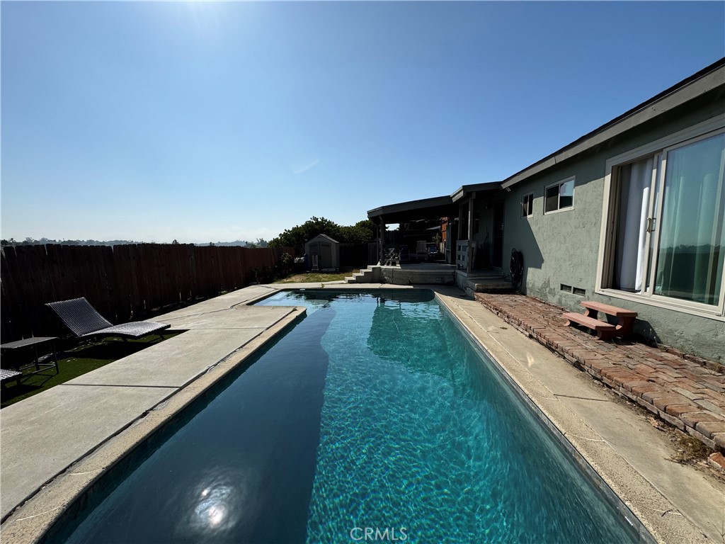 a view of a backyard with sitting area