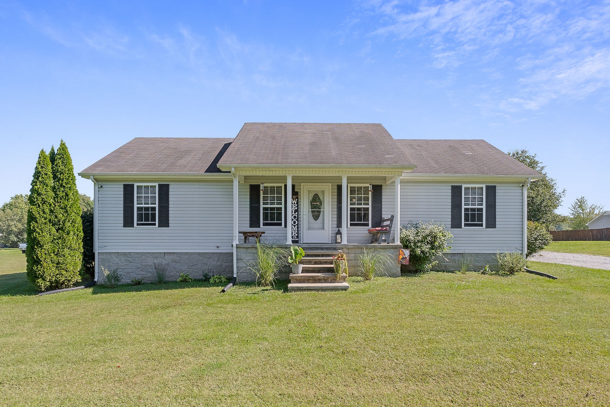 a front view of a house with garden