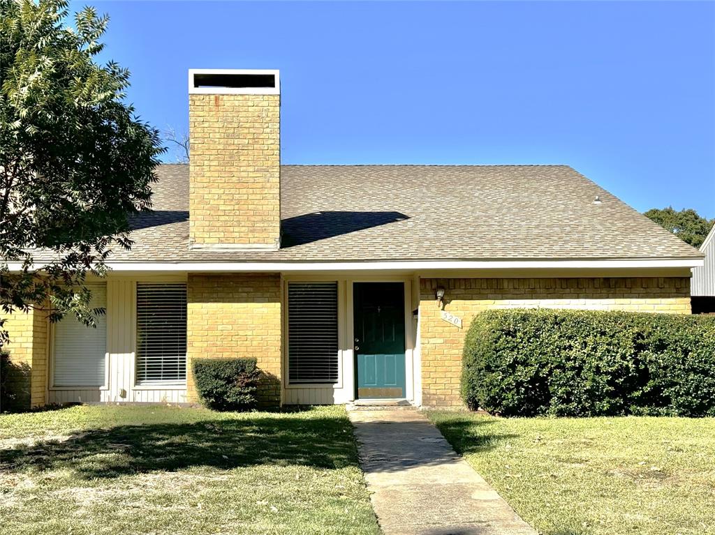 a view of house with yard