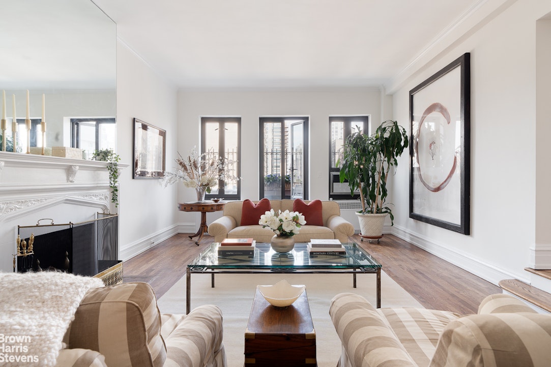 a living room with furniture or couch and a fireplace