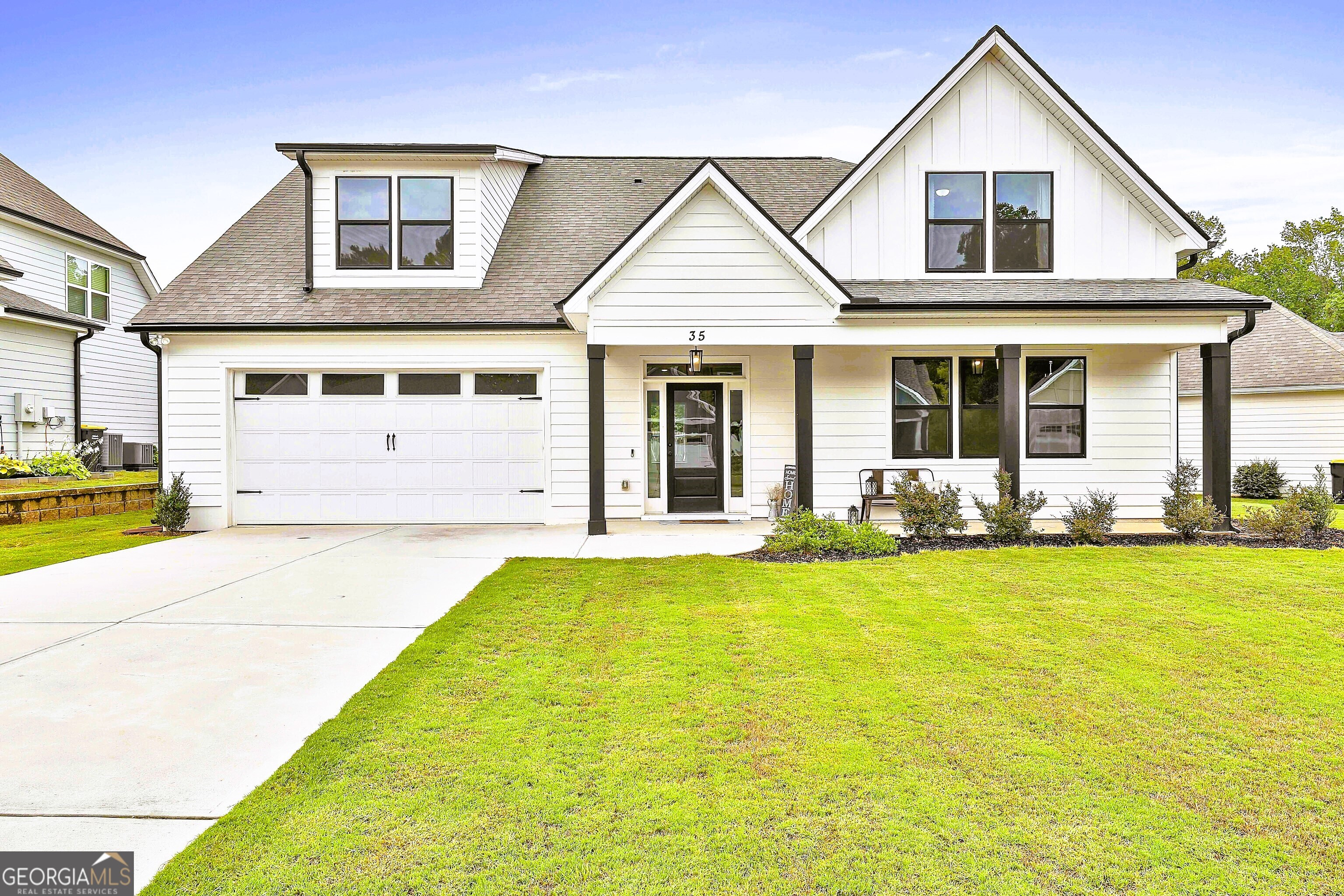 a front view of a house with swimming pool