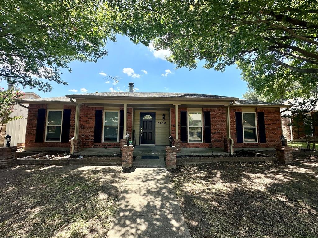 a front view of a house with yard in front of it