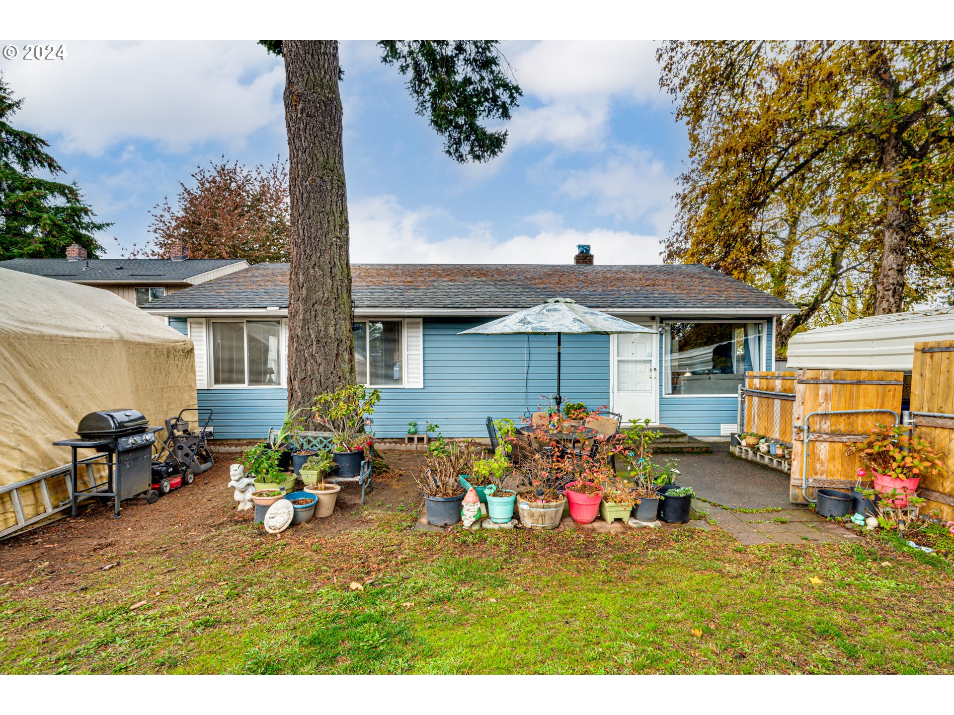 a house view with a seating space and garden